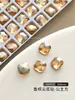 Accesorios para Uñas Estilo Popular de Celebridad de Internet Súper Brillante Color Champaña Corazón de Melocotón Torcido Forma Ovalada Especial Diamante Grande Decoración de Diamante para Uñas Venta al por Mayor