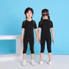 Conjunto de fitness de manga curta de secagem rápida transfronteiriço para esportes ao ar livre, unissex e infantil, roupa térmica de treinamento, respirável e justa ao corpo
