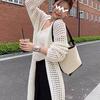 High-end Sense Knitted Cardigan Vest Conjunto de duas peças Verão Feminino Hollow-out Mid-length Top Thin Coat Macacão