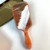 Bolsa de aire naranja transfronteriza Europa y Estados Unidos peine de onda de agua lámina acrílica peine de cojín de aire forma de mujer peine de masaje peine para cabello rizado