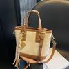 Bolso de mano popular para mujer, novedad de 2025, bolso de hombro con contraste de colores, bolso bandolera tipo cubo de alta gama.