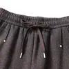 Novos estilos de outono e inverno para mulheres de meia-idade e idosas: calças forradas com fleece e cós elástico, calças cigarette estilo mom, padrão espinha de peixe, calças casuais cropped