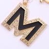 Llavero con colgante de aleación creativa con letras en inglés y gota de aceite de aleación con diamantes.