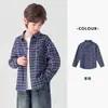 La camisa de cuadros para niño de Duoduo es un estilo de primavera y otoño, de corte holgado y estilizado, hecha de algodón puro, de manga larga, suave y transpirable, con cuello camisero.