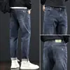 Jeans de Hombre de Primavera Hombres Venta al por Mayor Nuevos Rectos Sueltos Elásticos de Marca de Moda Adelgazantes Retro Americano Pantalones Largos Verano