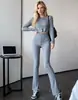 Novo conjunto de malha estilo europeu e americano para comércio exterior para outono e inverno, conjunto de duas peças com cardigã slim-fit e calça comprida, suéter moderno e estiloso para mulheres