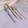 Pendientes largos con borla de nudo para mujer 2024 nuevo estilo popular pendientes de temperamento único pendientes de lujo ligero de alta gama de nicho