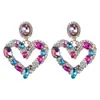 Europa y Estados Unidos aretes nuevos transfronterizos asimétricos color diamante huecos forma de corazón tendencia de moda aretes para fiesta