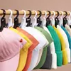 Clip de plástico multifuncional para colgar ropa y sombreros en la tienda, gancho giratorio, clip para colgar cortinas, clip para toallas, guantes y calcetines del hogar