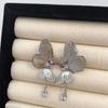 Super Hada Elegante Sentido Cool Zircón Púrpura Hueco Aretes de Mariposa para Mujer Lujo Ligero Exquisito Estilo Frío Moda Accesorios para la Oreja