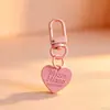 Hebilla de puerta colorida con colgante de corazón, lindo accesorio DIY de corazón de durazno, hebilla colgante metálica pintada de colores caramelo creativa