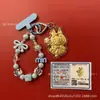 Llavero de tela con logo de empresa personalizado Cadena para teléfono móvil Angela Lámina de oro puro Oro 999 Regalo de aniversario