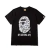 Comercio exterior mayorista transfronterizo estilo japonés moderno estampado de camuflaje cabeza de tiburón cabeza de tigre mono bloques de color luminoso para pareja camiseta holgada morada