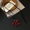 Fiebre de blogger de Corea del Sur con collar con colgante de lazo de amor para mujer 2024 explosiones Cadena roja para la clavícula Ankela