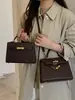 Bolso Kelly Vintage para Mujer 2024 Nuevo Modelo Bolso de Hombro Simple de Moda Bolso de Mano con Textura Única Bolso Cruzado