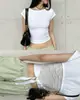 Nueva moda de verano europea y americana para mujer: empalme de encaje, con cordones, versátil, elegante, corte ajustado, camiseta básica sexy, top de puro deseo