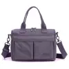 Bolso de mano cruzado hecho de tela de nailon, ligero, multi-compartimento, estilo workwear, gran capacidad, simple, impermeable, bolso de un solo hombro para mujer, modelo primavera/verano