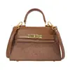 Bolso de Mano de Lujo Tipo Kelly para Mujer 2026 Transfronterizo Nueva Moda Temperamento Versátil Hombro Cruzado Bolso Cuadrado Pequeño de Moda