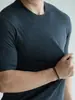 Camiseta masculina de manga curta com textura de tricô feita de seda de amoreira e lã, adequada para fitness e uso casual, com gola pequena a média, coleção outono 2026