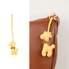 Bolsa de jirafa de moda de alta gama, estilo nuevo, versátil, linda, colgante, borla de bufanda de seda, accesorio de regalo pequeño, transfronterizo