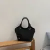 Bolso tipo cubo de nicho estilo coreano para mujer, nuevo bolso de mano de moda verano 2026, bolso cruzado para el trabajo y los desplazamientos, bolso de hombro simple