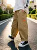 Pantalones Casuales de Primavera y Otoño para Niños y Niñas Moda Infantil Personalidad Tendencia Estilo Coreano Parche de Dibujos Animados Elegante Ropa de Trabajo Pantalones Largos