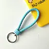 Llavero creativo de cuerda de cuero tejido a mano para pareja, llavero de coche, llavero al por mayor, colgante para bolso