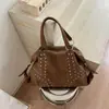 Bolso de mujer transfronterizo de gran capacidad 2026 nuevo casual con tachuelas para el hombro y la axila para viajes y desplazamientos bolso tote