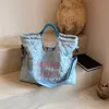 Otoño 2026 Nuevo Bolso de Gran Capacidad para Estudiantes y Viajes Diarios Bolso Tote Portátil para Mujer Bolso de Hombro con Bordado de Letras Bolso Cruzado