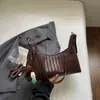 Shuai Mijia 2026 Nova Bolsa Estilosa com Padrão Trançado Formato de Pastel para Mulheres, Bolsa de Ombro Fashionável com Personalidade para o Dia a Dia, Bolsa de Braço, Bolsa de Mão