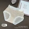 Falda Xiaolan primavera y verano estilo francés sexy deseo puro ropa interior de seda de hielo para mujer cintura media borde de encaje chica bragas sin costuras E007