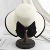 Chapéu de palha infantil verão proteção solar dobrável aba larga borda com laço abertura para rabo de cavalo moda temperamento versão coreana