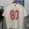 Novo Estilo Europeu e Americano Design Vazado 80 Estrelas Digitais Blusa de Tricô Solta Gola Redonda Manga Curta Esportiva Tendência Masculino e Feminino