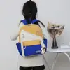 Primavera 2023 nueva mochila escolar de jardín de infantes de color de contraste grande, mediana y pequeña linda caricatura mochila para niños pequeños