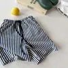 Ropa infantil 2026 primavera y verano nuevo estilo coreano shorts de verano, pantalones de longitud media, pantalones cortos para niños y niñas 7259