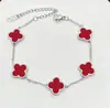 Pulsera de acero de titanio chapada en oro de 18k, de cuatro hojas, lisa, de moda, de venta caliente, con nácar de doble cara, fábrica de joyería de alta gama para mujer