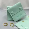 Bolsita de Broche Anillo Collar Pulsera de Microfibra Verde Real Personalizada Bolsita de Joyería Elegante Bolsita de Tela Plegable Personalizada Según Especificaciones