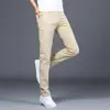 Pantalones casuales para hombre, nuevos pantalones tipo cigarrillo ajustados de negocios color caqui para primavera y otoño, pantalones largos elásticos para hombre, versátiles de largo nueve puntos
