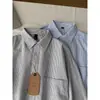 Camisa retro de estilo japonés Oxford a rayas, de manga larga, corte holgado, casual, con cuello de solapa, adecuada como camisa de trabajo o prenda exterior de otoño para ir al trabajo.