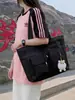 Transfronterizo 2026 principios de otoño nuevo nailon negro simple ligero doble bolsillo bolso de mano bandolera venta al por mayor