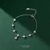 Colar série trevo de quatro folhas s999 prata pura zircônia para mulheres, versátil, moderno, de alta qualidade, design de nicho, corrente sólida de prata para clavícula