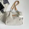 Bolso de mujer 2026 otoño nuevo estilo coreano mochila escolar para estudiante bolso de hombro simple y moderno bolso tote de gran capacidad para ir al trabajo