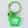 Llavero con Colgante de Campana de Estrella de Cinco Puntas de Colores Caramelo de Aleación Cubierta para Auriculares Decoración de Pareja