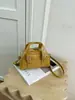 Bolsa de boliche de mano de nicho de alta gama transfronteriza para mujer, nueva y elegante, bolsa tipo concha retro, bandolera cruzada versátil