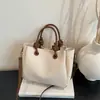Bolso de mano elegante y versátil para mujer, nuevo diseño moderno 2026, adecuado para ir al trabajo, se puede llevar en la mano o usar como bolso de hombro o bolso cruzado