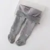 Calças legging infantis forradas com lã polar, estampa de listras verticais e laço, em algodão grosso, coleção outono/inverno 2026.