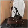 Bolso cruzado de moda transfronterizo 2026, nuevo diseño de nicho, con cinturón decorado, personalidad dulce y genial