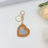 Espelho de Bolso Portátil com Pingente de Chaveiro Coração de Pêssego Desenho Animado Menina Espelho de Maquiagem Criativo Fofo Versátil Bolsa Transfronteiriça