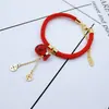 Pulsera de Bolsillo para Dinero con Borla de Cuerda Roja Benmingnian para Mujer Estilo Coreano Tejida a Mano Simple Personalizada Versátil Fresca Cuerda de Mano de Acero de Titanio