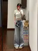 Jeans acampanados lavados azul claro estilo americano para mujer, nueva colección otoño 2026, de cintura alta, no ajustados y con una silueta fluida